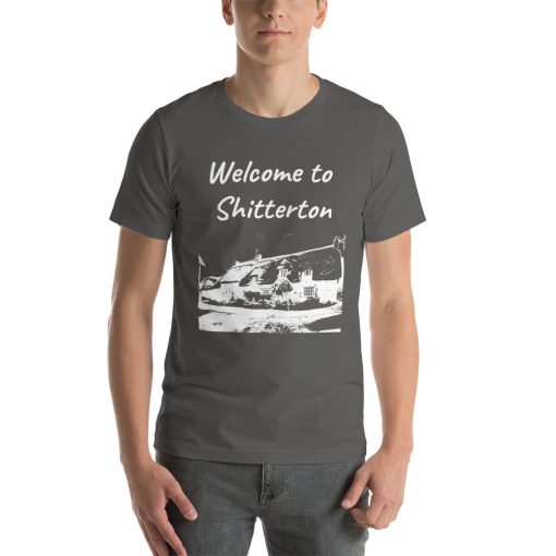 Unisex t-shirt that says "Welcome to Shitterton" on it. Underneath is a picture of a landmark from Shitterton.