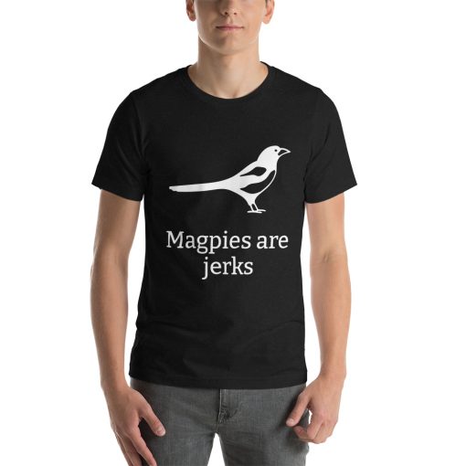 Unisex t-shirt with a picture of a magpie on it. Underneath it says "Magpies are jerks."