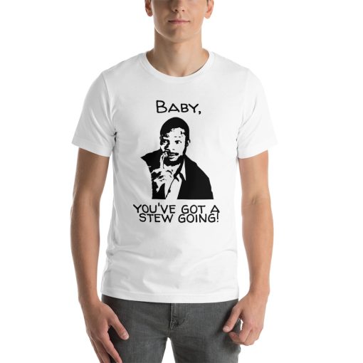 Unisex t-shirt with a picture of Carl Weathers holding a stew bone. The text says "Baby, you've got a stew going!"