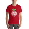 Unisex t-shirt that says "eat your veggies" in a stylized way. It also has a picture of a hand holding vegetables.