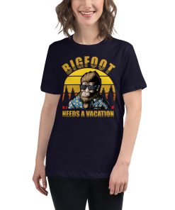 Women's t-shirt that says "Bigfoot needs a vacation" on it with a picture of Bigfoot wearing sunglasses.