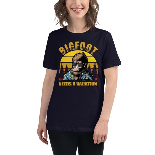 Women's t-shirt that says "Bigfoot needs a vacation" on it with a picture of Bigfoot wearing sunglasses.