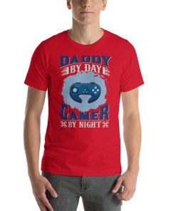 Unisex t-shirt that says "Daddy by day, gamer by night" on it.