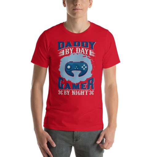 Unisex t-shirt that says "Daddy by day, gamer by night" on it.